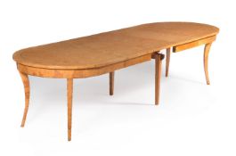 A Baltic karelian birch extending dining table