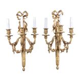 A set of six French gilt bronze three light wall appliques in Louis XVI style