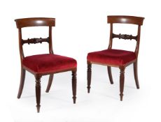 A set of nine George IV mahogany dining chairs