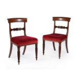 A set of nine George IV mahogany dining chairs