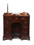 A George II walnut kneehole desk
