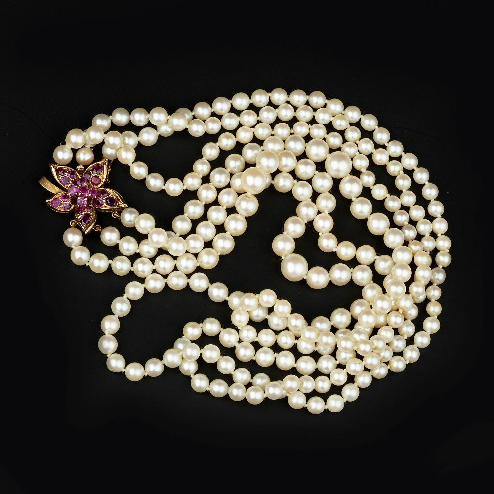 A three row cultured pearl necklace