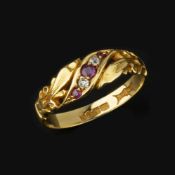 An 18 carat gold ruby and diamond ring