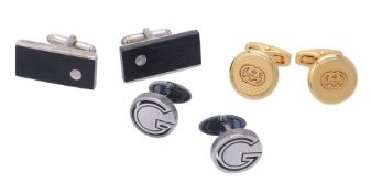A pair of wood and silver coloured cufflinks by Gucci