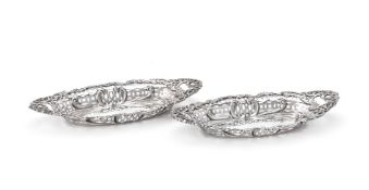 A pair of Edwardian silver shaped navette sweet dishes by Henry Matthews