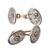 A pair of early 20th century diamond two colour cufflinks
