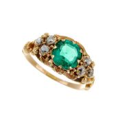 A emerald and diamond seven stone ring