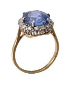 A natural colour change sapphire and diamond cluster ring