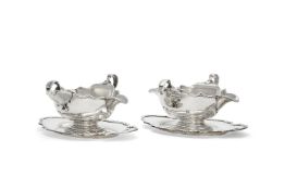 A pair of silver shaped oval sauce boats and stands by S. J. Phillips Ltd