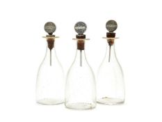 A set of three Art Deco silver mounted Webb glass small decanters by Dingley Bros