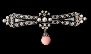 An early 20th century conch pearl, diamond, pearl, and onyx brooch