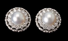 A pair of diamond and cultured pearl cluster ear clips
