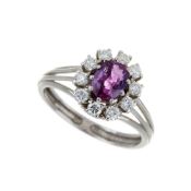 A purplish pink sapphire and diamond cluster ring