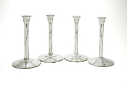 Two pairs of plain silver candlesticks by Theo Fennell