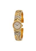 A gold coloured and diamond sprung bangle watch