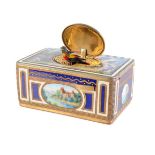 A gilt metal and enamel singing bird musical box