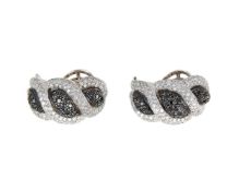 A pair of diamond and black diamond earrings