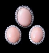 ϒ A diamond and coral dress ring and ear clips by Piaget