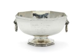 A silver octagonal pedestal punch bowl by The Goldsmiths & Silversmiths Co. Ltd