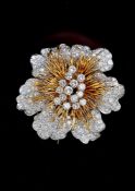 A 1970s 18 carat gold and diamond flower head brooch by Kutchinsky
