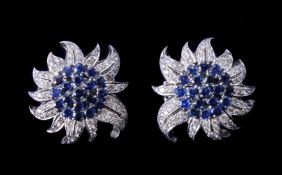A pair of sapphire and diamond flower head earrings