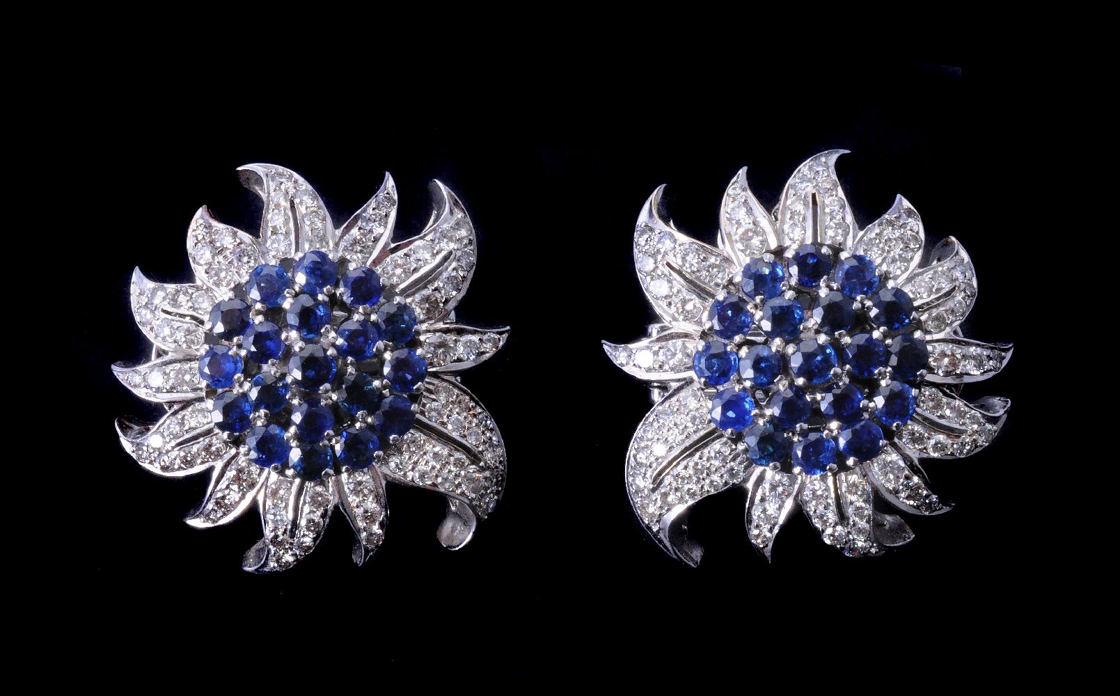 A pair of sapphire and diamond flower head earrings