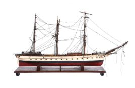 A painted wood display model of a three masted square rigger