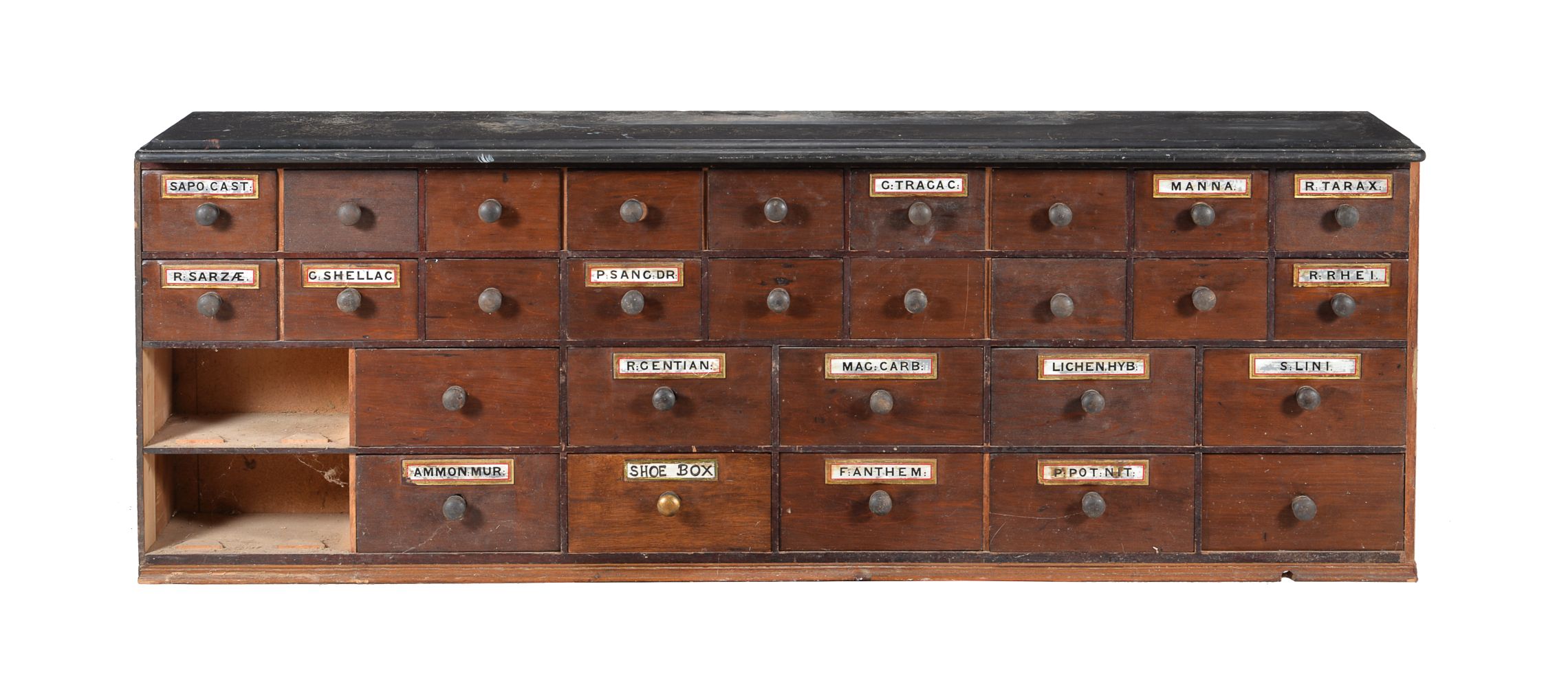 A mahogany apothecary cabinet with black marble top