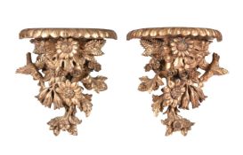 A pair of carved giltwood wall brackets in Rococo taste