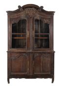 A Continental carved oak cabinet