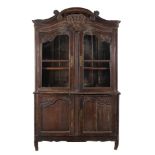 A Continental carved oak cabinet