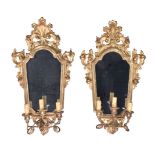 A pair of giltwood and composition three light girandoles