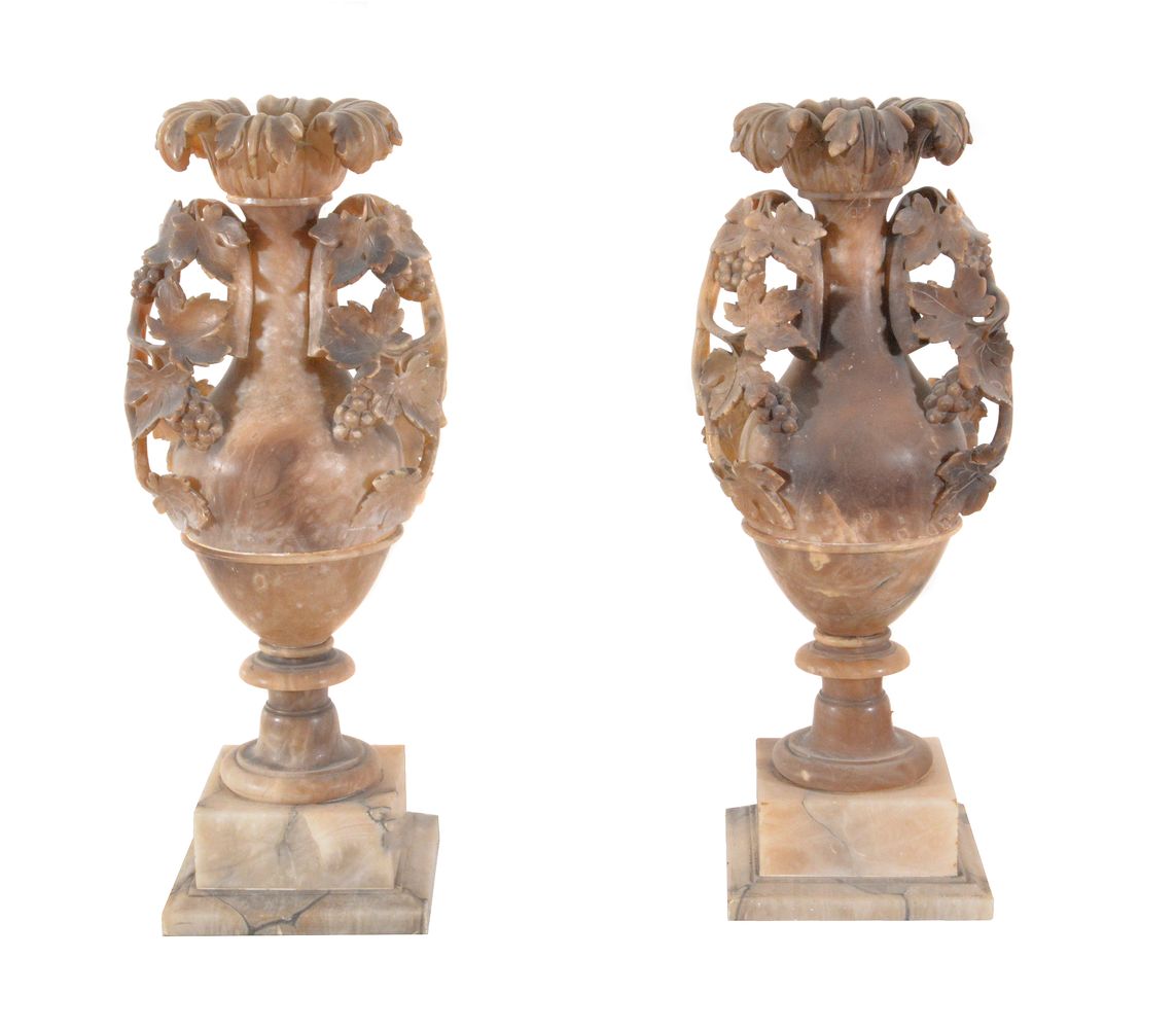 A pair of Italian turned and carved alabaster vases