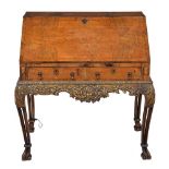 A walnut and seaweed marquetry bureau on stand