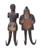 Two Tyrolean carved and painted wood and horn mounted figural wall hooks