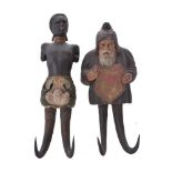 Two Tyrolean carved and painted wood and horn mounted figural wall hooks