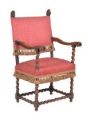 A walnut and upholstered armchair in late 17th century style