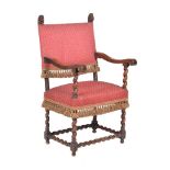 A walnut and upholstered armchair in late 17th century style