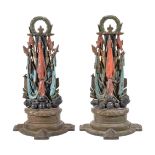 A pair of Victorian painted cast iron door porters modelled as trophies of war