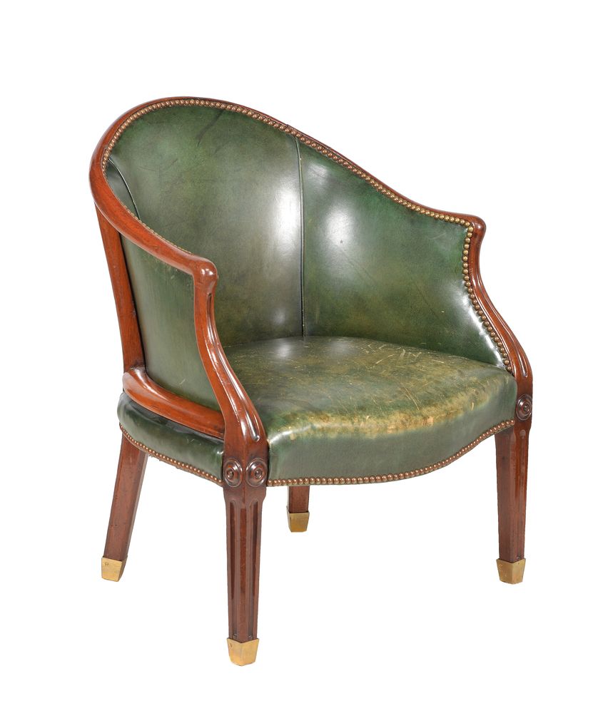 A George III mahogany and leather upholstered tub armchair