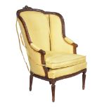 A walnut and yellow upholstered armchair in Louis XVI style