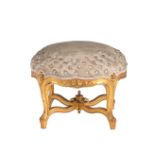 A circular giltwood and button upholstered footstool