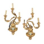 A pair of Italian giltwood and composition three light wall appliques in 18th century taste