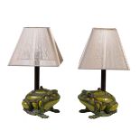 A pair of painted cast iron and reverse painted glass table lamps