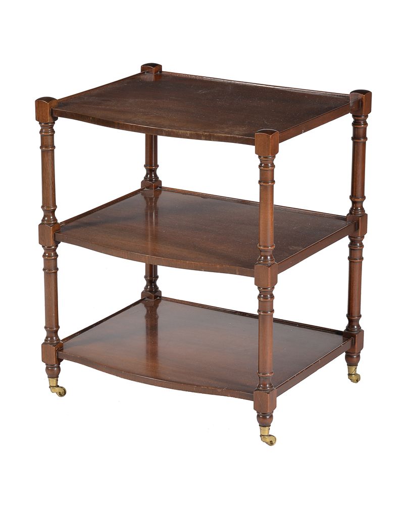 A pair of mahogany three tier side tables