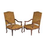 A matched pair of walnut armchairs