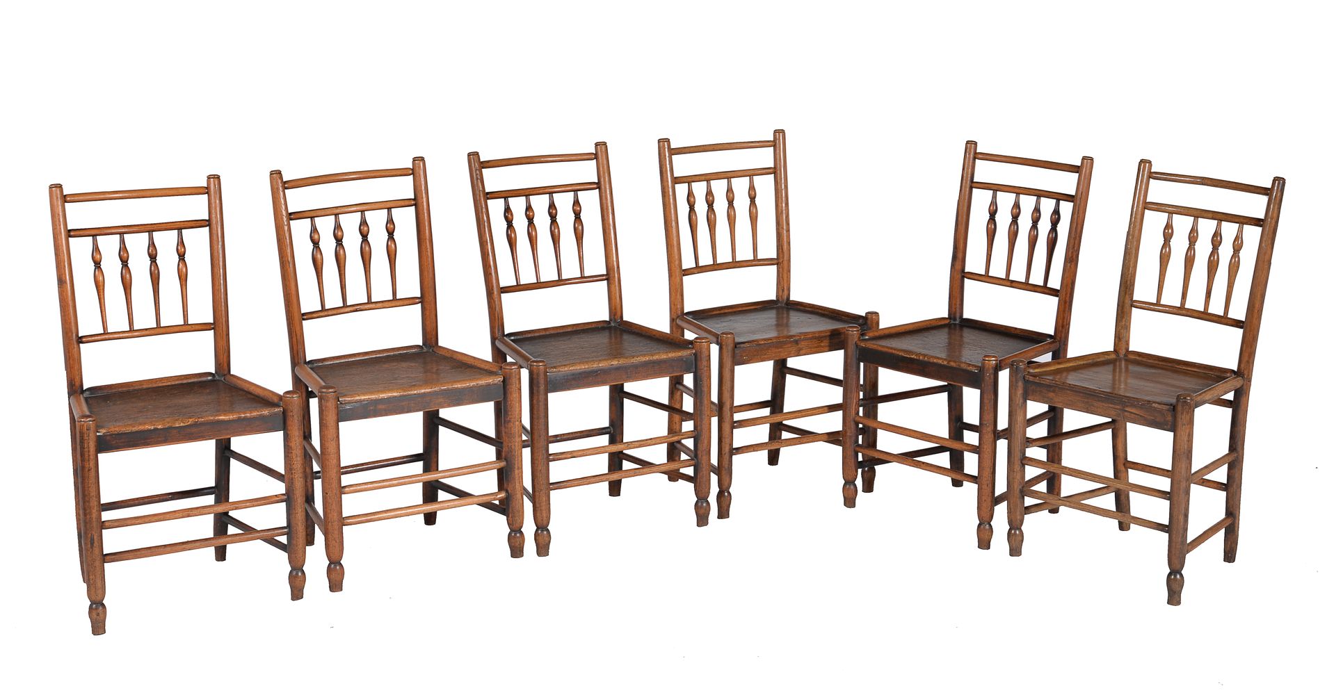 A set of six ash and elm spindle back chairs