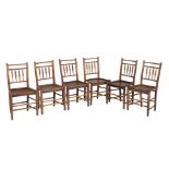 A set of six ash and elm spindle back chairs