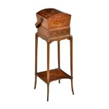 ϒ A Sheraton Revival burr yew, tulipwood, and rosewood banded lady’s work box on stand