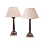 A pair of gilt metal mounted tinted glass table lamps
